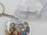 a keychain with a picture of jesus and mary inside of it