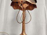 a close up of a lamp on a table with a white background