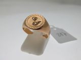 an image of a gold signet ring with the letter s on it