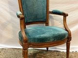 an image of a chair with a blue upholstered seat