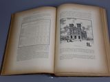 an open book with a drawing of a church on it