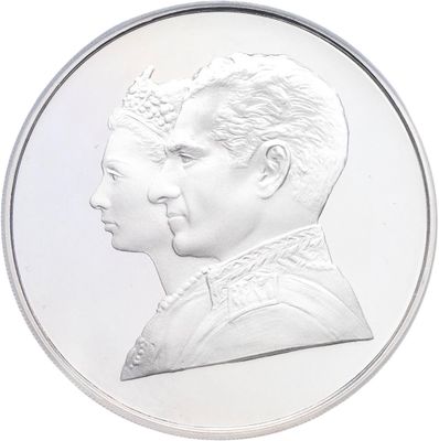 the two heads of a man and a woman are depicted on a silver coin