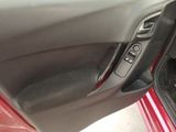 the interior of a car with the door open and the driver ' s seat up