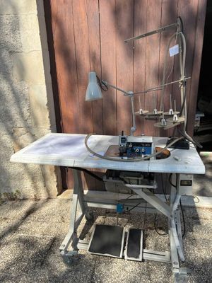 a sewing machine that is sitting on a table