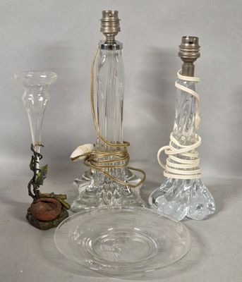 a glass table with a candle and a glass plate on it