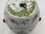 a white bowl with a bird and flowers design on it