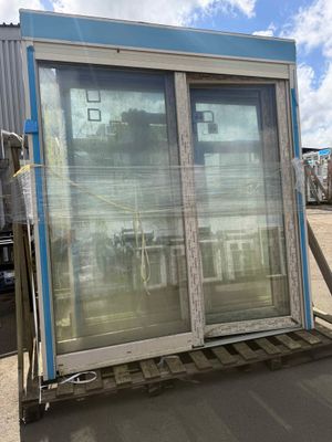 an image of a large window on a pallet in a parking lot