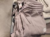 a pile of clothing on a table in a store
