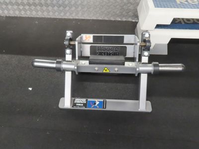 a machine that is sitting on the floor next to a box