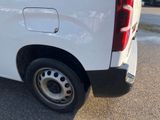 a white van that is parked in the parking lot