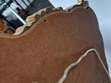 a close up of a baseball mitt with a ball in it