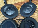 a pair of headphones sitting on top of a wooden table