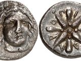 a silver coin with a face of a man on it