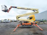 a picture of a crane that is sitting in a parking lot