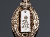 a close up of a medal on a black surface