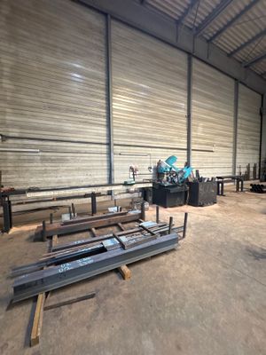 a large warehouse with a lot of metal items in it