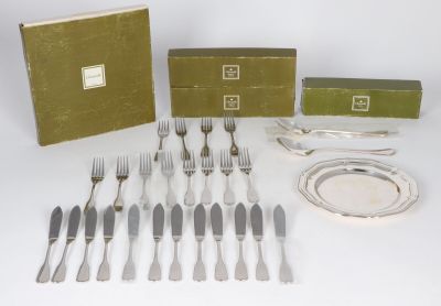 an assortment of silverware including forks, knives, and a box