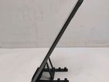 a tablet computer sitting on a stand on a white surface