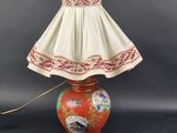 a lamp that is sitting on a table with a lamp shade on it