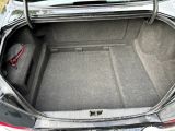 a trunk of a car with a seat in it