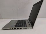 a laptop that is sitting on a white table