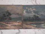 deux tableaux représentant un paysage, posés sur un plateau de table en marbre