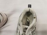 a close up of a pair of shoes on a white surface