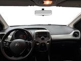 the interior of a car with a dash light and a steering wheel