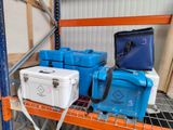 many coolers and boxes on a shelf in a warehouse