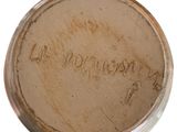 an image of a close up of a metal object with writing on it