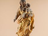 an image of a statue of a woman holding a child