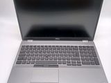 an open laptop computer sitting on top of a white table