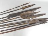 several different types of weapons are displayed on a white surface