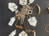 a lot of gold and silver jewelry on a table