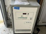 a machine that is sitting inside of a garage