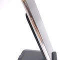 a cell phone that is sitting on top of a stand