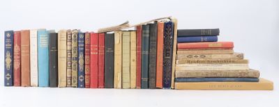 many books stacked on top of each other on a table