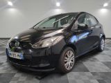 the toyota yaris is parked in the garage on a checkered floor