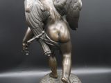 an image of a statue of an angel on a marble base