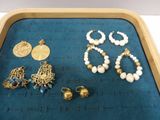 a tray that has a bunch of jewelry on it