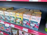 many boxes of food on the shelf in the store