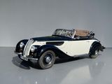 an image of a classic car in a white room