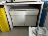 a microwave that is on top of a white cabinet
