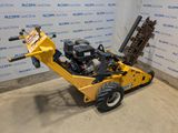 an image of a small machine that is parked in a room