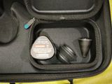 a black case with a pair of headphones inside of it