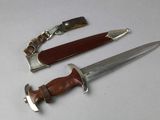 two knives that are sitting next to each other on a table