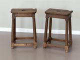 deux tabourets en bois posés sur un parquet en bois dur