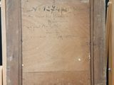 an old picture of a wooden frame with writing on it