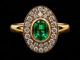an oval emerald and diamond ring