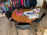 a table with a bunch of clothes on it in a room